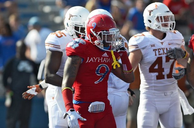 Then-sophomore Fish Smithson gathers himself during Kansas' 23-0 loss to Texas in 2014. Photo credit: Amy Zhang